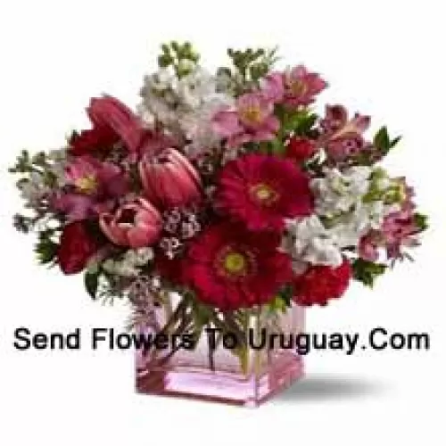 Red Roses, Red Tulips And Assorted Flowers With Seasonal Fillers Arranged Beautifully In A Glass Vase