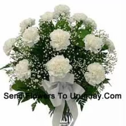 18 White Carnations With Seasonal Fillers In A Glass Vase