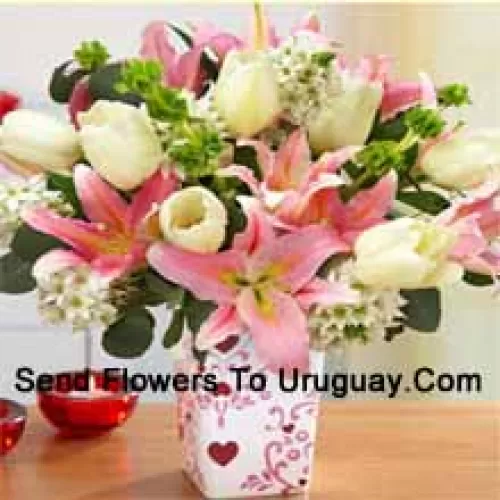 Pink Lilies And White Tulips With Assorted White Fillers In A Glass Vase - Please Note That In Case Of Non-Availability Of Certain Seasonal Flowers The Same Will Be Substituted With Other Flowers Of Same Value