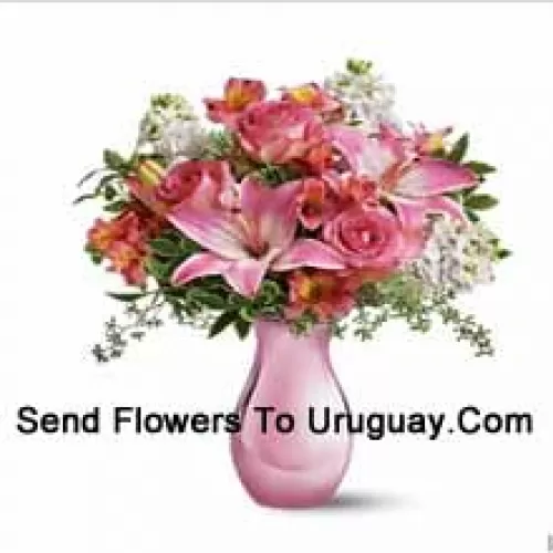 Pink Roses, Pink Lilies And Assorted White Flowers With Some Ferns In A Glass Vase