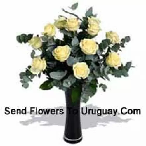 12 White Roses With Some Ferns In A Vase