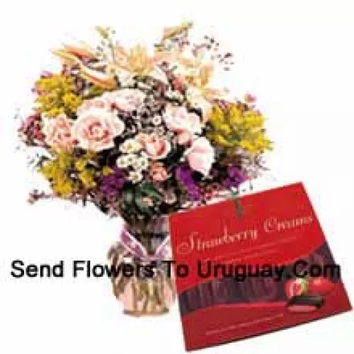 Assorted Flowers In A Vase And A Box Of Chocolate