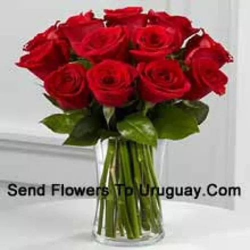 12 Red Roses With Some Ferns In A Vase