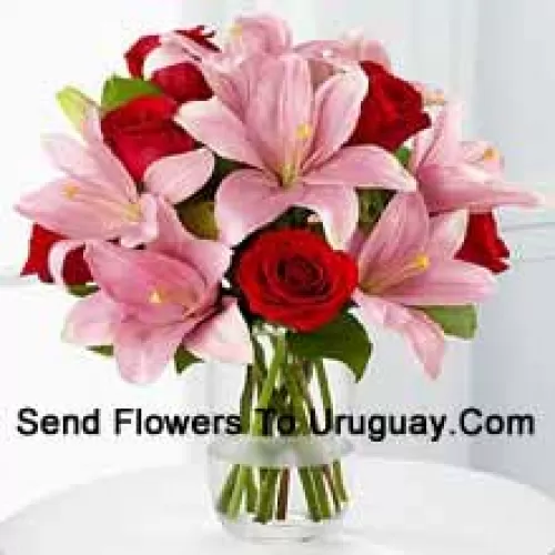 Red Roses And Pink Lilies With Seasonal Fillers In A Glass Vase