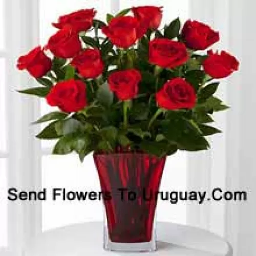 12 Red Roses With Some Ferns In A Vase